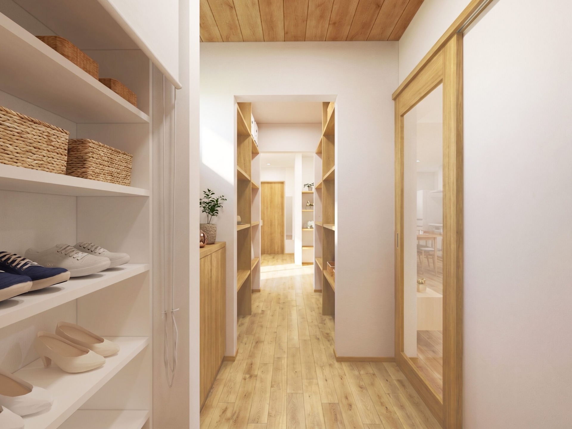 Walk-in closet with white shelves on the left, woven baskets, and light wooden floors extending down a corridor.